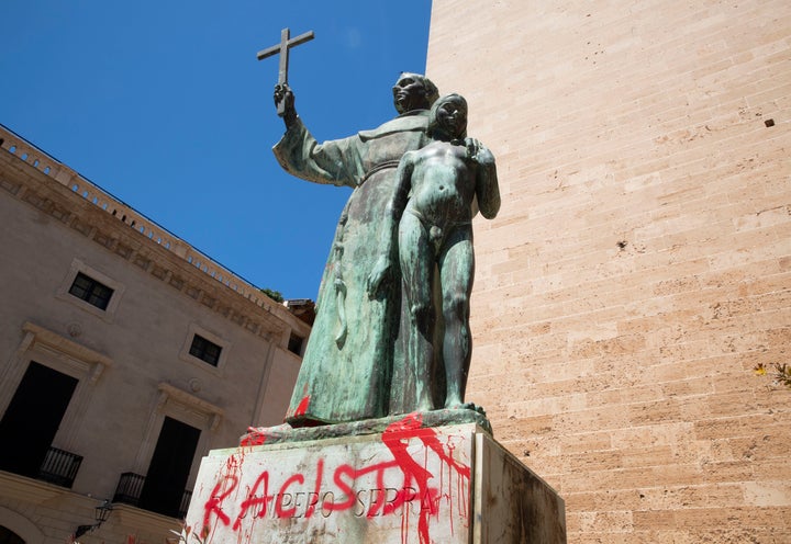 A statue of Catholic St. Junipero Serra in Palma de Mallorca, Spain, on Monday after it was daubed with graffiti reading "rac