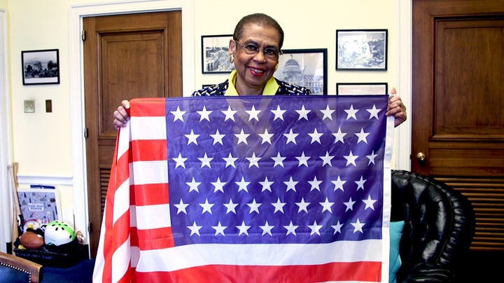 D.C. Del. Eleanor Holmes Norton presents an American flag with 51 stars, commemorating the possibility of adding D.C. as the 51st state, in her Capitol Hill office on February 18, 2020.