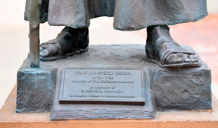 A statue of Junipero Serra in front of the San Gabriel Mission.