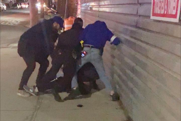 In this image made from video, New York City police officers forcefully arrest 20-year-old Fitzroy Gayle in the Brooklyn borough of New York, March 4, 2020.