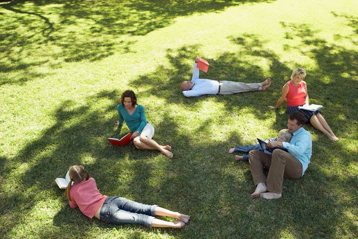 Family and friends reading together