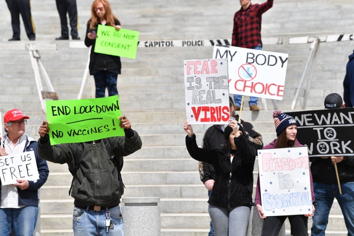 People take part in a "reopen Pennsylvania" demonstration April 20 in Harrisburg.