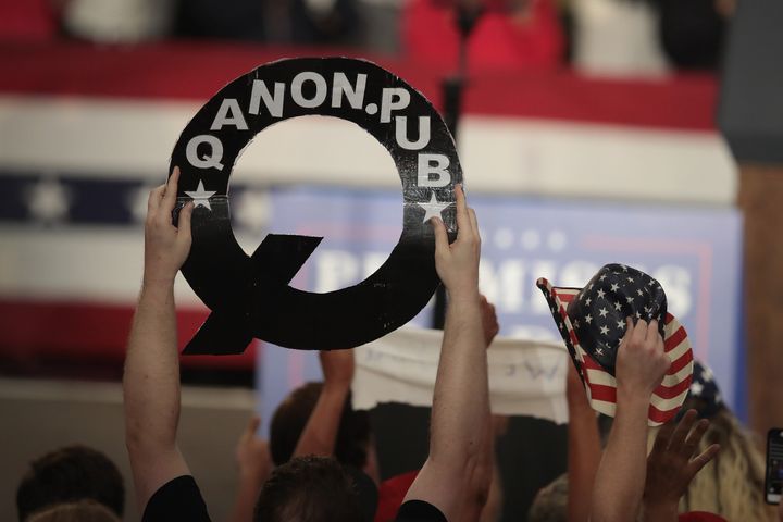 QAnon is a sprawling online extremist movement that baselessly claims President Donald Trump is waging a secret war against a “deep state” cabal of Satanist elites running an international child sex trafficking ring.