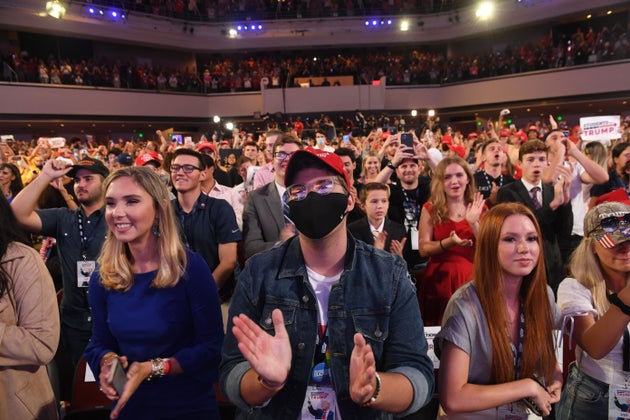 Supporters listen as President Donald Trump speaks at a Students for Trump event at the Dream City Church...