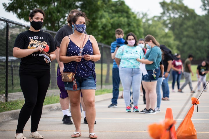 Patients wait in line at a testing site in Dallas, Texas. 