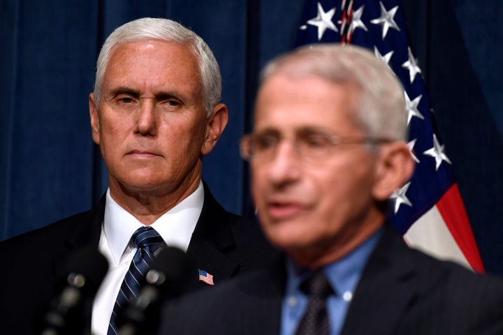 Director of the National Institute of Allergy and Infectious Diseases Dr. Anthony Fauci, right, speaks during a news conference with members of the Coronavirus task force, including Vice President Mike Pence, left, at the Department of Health and Human Services in Washington, Friday, June 26, 2020. (AP Photo/Susan Walsh)