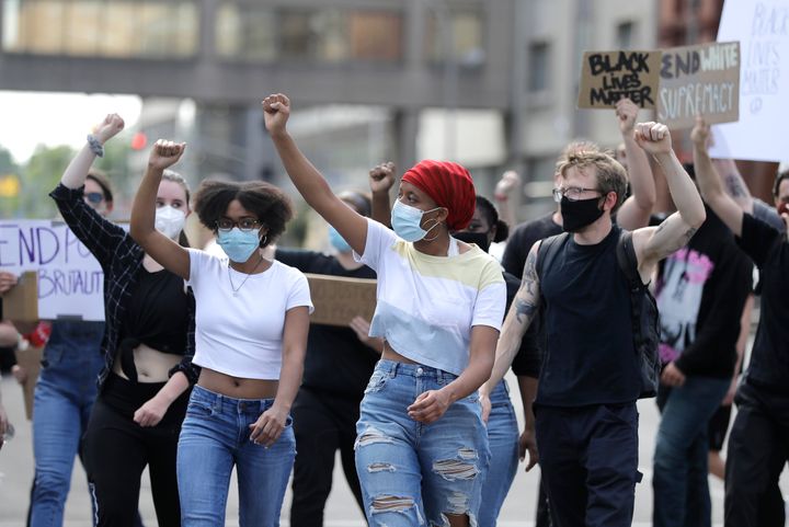 A group marches to Jefferson Square to join a protest over the deaths of George Floyd and Breonna Taylor, Tuesday, June 2, 2020, in Louisville, Ky. 