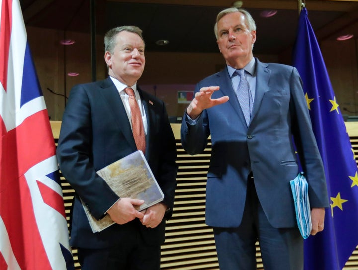 European Union chief Brexit negotiator Michel Barnier, right, speaks with his UK opposite number David Frost during the start of the first round of post -Brexit trade talks in March.