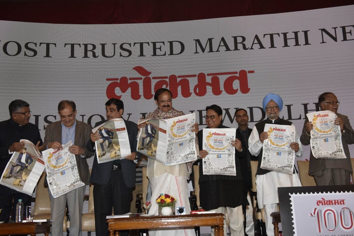 Vice President Venkiah Naidu (C), former prime minister Manmohan Singh (2 R) and Lokmat Media Group Chairman Vijay Darda (3 R), Nitin Gadkari (3 L) with others at launch Marathi daily Lokmat's Delhi edition in its centenary year on December 14, 2017 in New Delhi