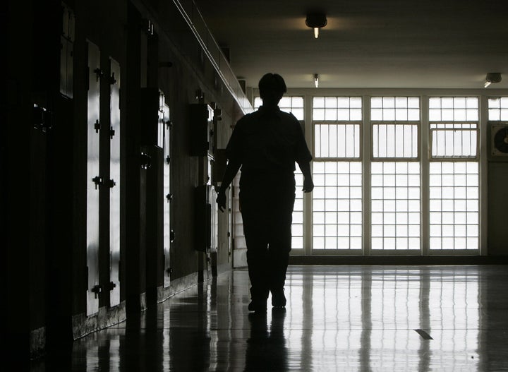 A file image of a prison guard. The Ministry of Justice is planning four new British jails – though only one has a home as yet