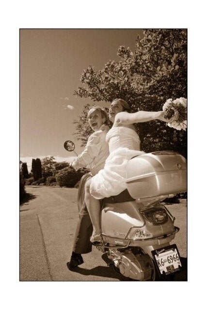 The couple riding a scooter for a wedding photo in 2006.