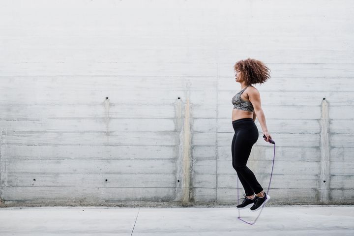exercising, a woman doing her jumprope.