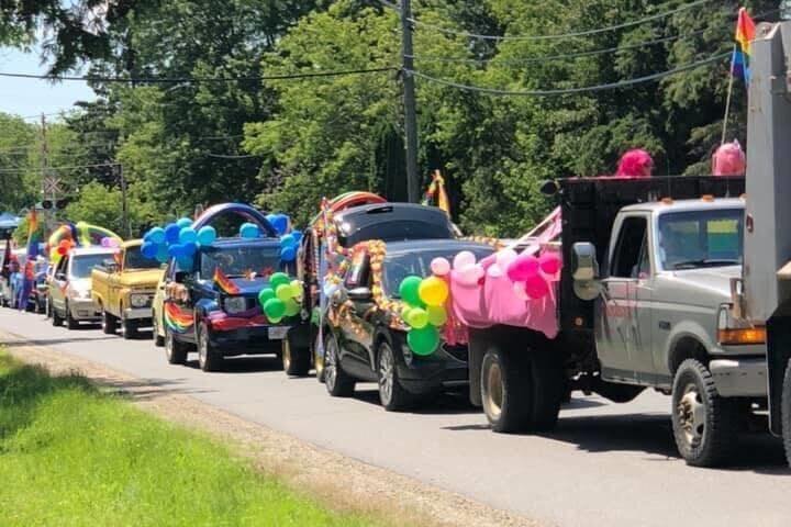 A convoy of vehicles drives through Emo, Ont. to celebrate LGBTQ Pride on June 27, 2010.