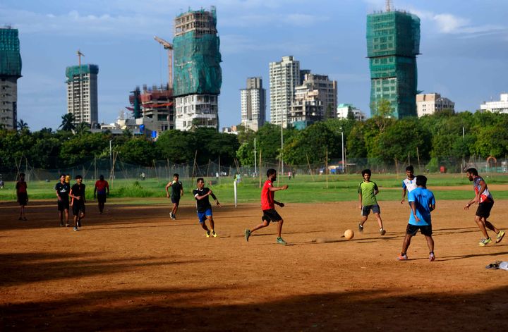 Boys playing football at Dadar Shivaji Park maidan, on June 9, 2020 in Mumbai.