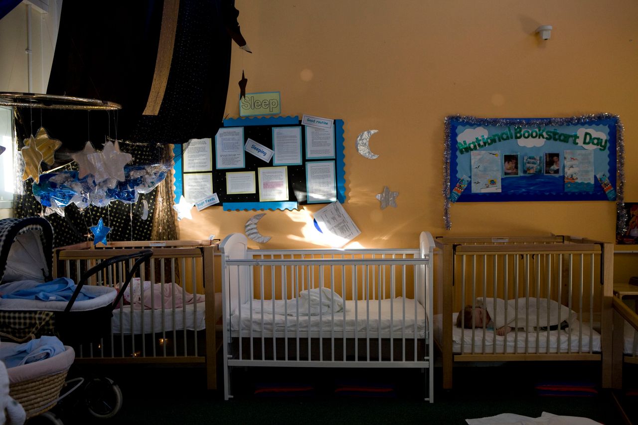 Babies sleeping in cots in the mother and baby unit at HMP Askham Grange