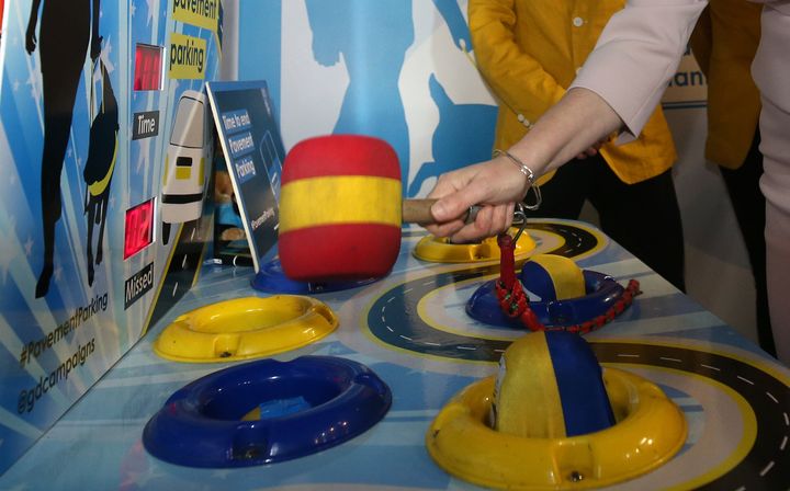 A whack-a-mole game, modelled by Scottish first minister Nicola Sturgeon