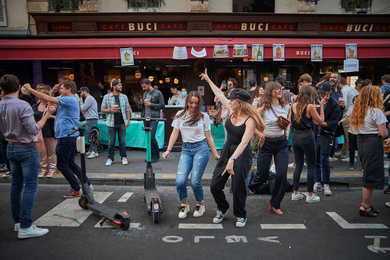 Parisians dance in the street in the 6th Arrondissement as Paris celebrates the first day of summer with Fete de La Musique with bands playing across the city on June 21.