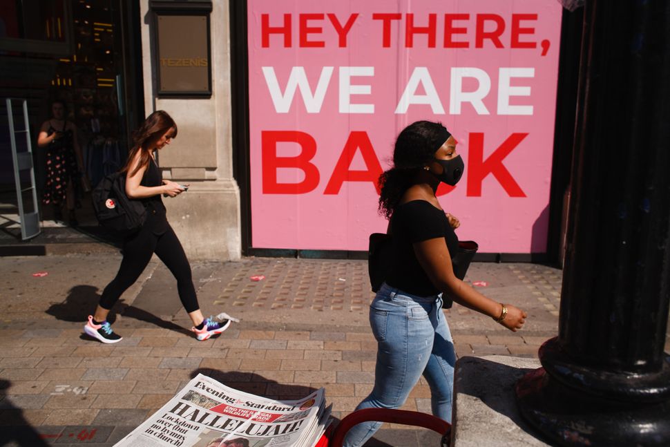 Shops in Oxford Circus in London celebrate the further easing of Britain's lockdown restrictions, aimed at reviving the economy, June 23.