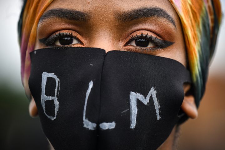 EDINBURGH, UNITED KINGDOM - JUNE 07: A woman with mask at the Black Lives Matter protest in Holyrood Park (Photo by Jeff J Mitchell/Getty Images)