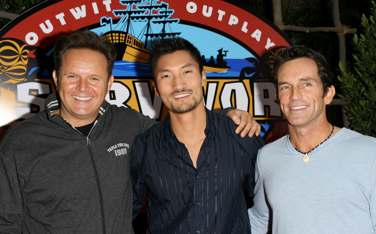 Mark Burnett (left) and Kwon (center), who won Season 13 of "Survivor." 