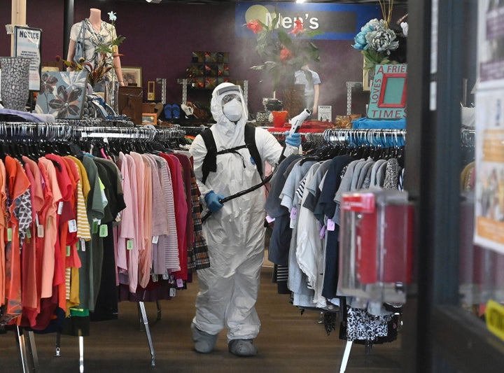 A crew equipped with electrostatic sprayers cleans a Goodwill store with a hydrogen peroxide disinfectant cleaner in Colorado Springs, Colorodo.