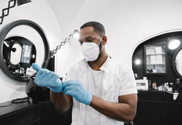 Gloves and personal protective equipment are an extra step of protection that salon staff may use considering the long periods of time spent inside, but likely won't ask customers to.