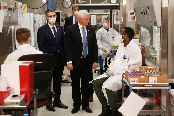 Vice President Mike Pence visits the molecular testing lab at the Mayo Clinic in Rochester, Minnesota. Pence chose not to wear a face mask, an apparent violation of the medical center's policy.