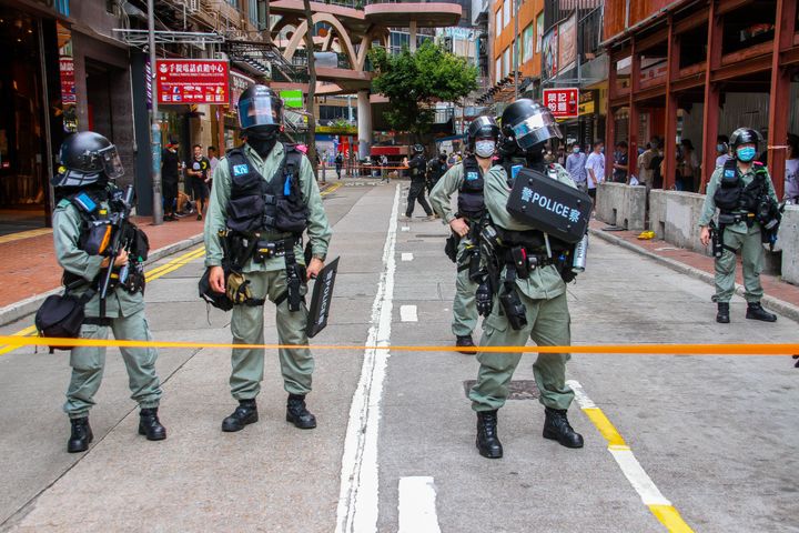 Police stand behind the cordon line during street rallies in Causeway Bay, Hong Kong, China on July 1, 2020. (Photo by Tommy Walker/NurPhoto via Getty Images)
