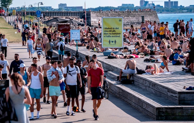 A sign in Malmo, Sweden, asks people to keep social distance due to coronavirus pandemic on June 25, 2020.