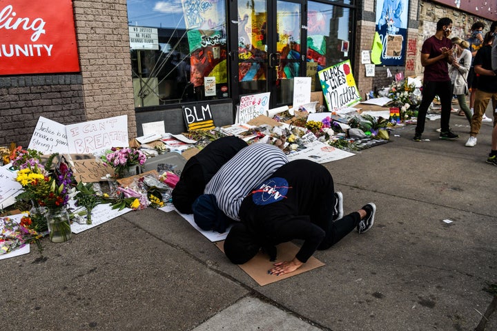 Muslim women offer evening prayers at a makeshift memorial in honor of George Floyd in Minneapolis on June 4.