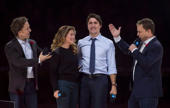 Craig (left) and Marc Kielburger introduce Prime Minister Justin Trudeau and his wife Sophie Gregoire-Trudeau as they appear at the WE Day celebrations in Ottawa on Nov. 10, 2015.