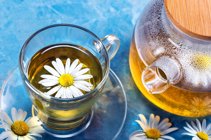 Chamomile tea. Cup and teapot with tea.