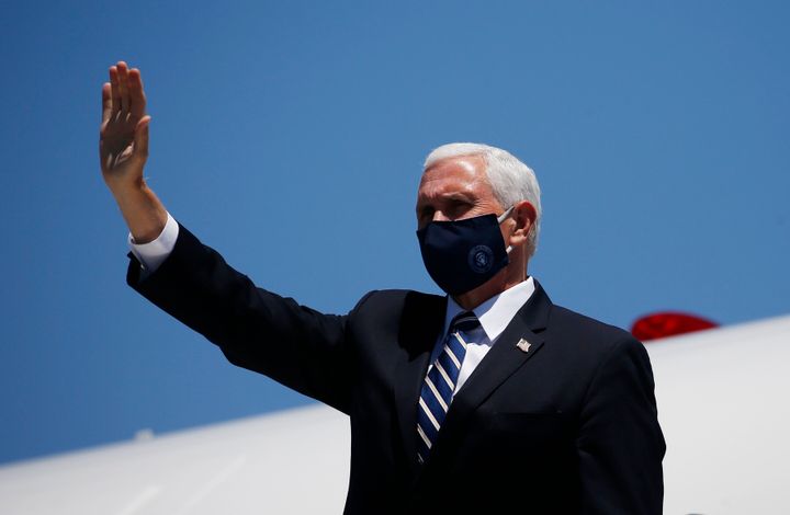 Vice President Mike Pence arrives in Phoenix to meet with Arizona Gov. Doug Ducey on Wednesday. His trip to the state was delayed by a day in part because several Secret Service agents contracted COVID-19.