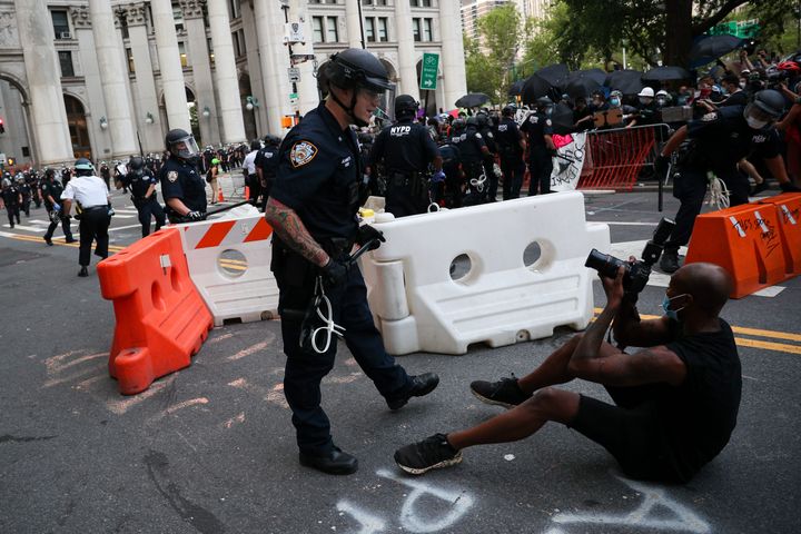 Police officers clash with Black Lives Matter protestors who locked down the streets by City Hall and Police Plaza where hundreds congregates as part of the "Defund NYPD" and "Occupy City Hall" movement on July 1.