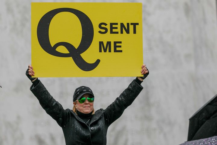 A QAnon conspiracy theorist demonstrates at an anti-quarantine protest in Salem, Oregon, on May 2.