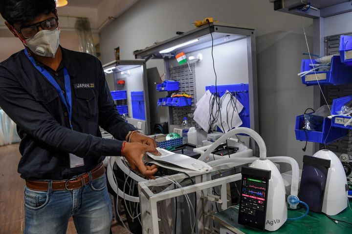 In this photo taken on March 25, 2020, AgVa Healthcare employee Vaibhav Gupta demonstrates using a ventilator at the research and development (R&D) centre in Noida in Uttar Pradesh state.