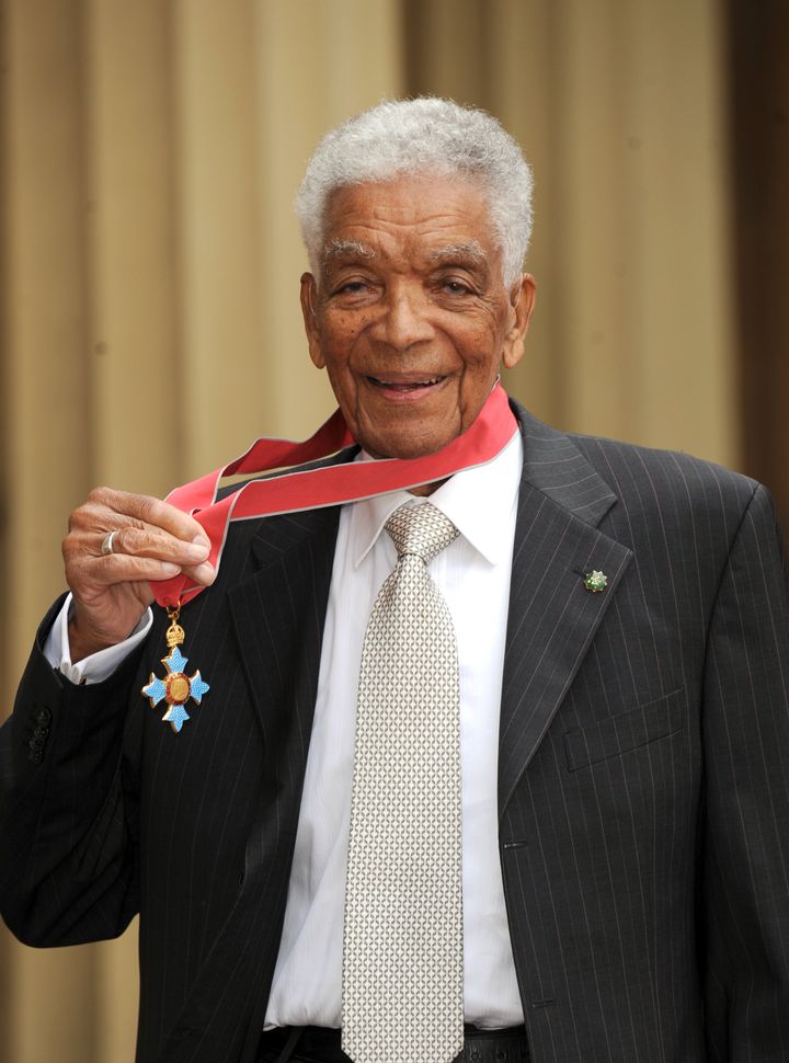 Earl Cameron outside Buckingham Palace after receiving his CBE