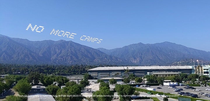 A mock up of the skytyped phrase "NO MORE CAMPS," chosen by artist Tsuru for Solidarity -- Karen Ishizuka. It will be seen over the Santa Anita Assembly Center during the In Plain Sight day of action over July 4 weekend in Los Angeles. 