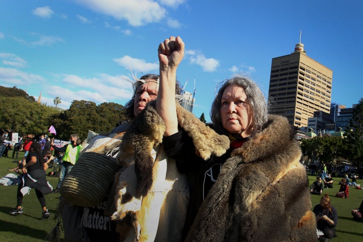 SYDNEY, AUSTRALIA - JULY 05: Aboriginal elders raise their arms towards the sky during a rally against Aboriginal and Torres Strait Islander deaths in custody in The Domain on July 05, 2020 in Sydney, Australia. Since the Royal Commission into Aboriginal deaths in custody ended in 1991 there have been over 400 deaths. Rallies have been organised across the country in solidarity with the global Black Lives Matter movement. (Photo by Lisa Maree Williams/Getty Images)