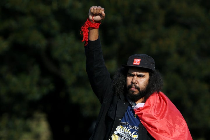 SYDNEY, AUSTRALIA - JULY 05: A protester raises his arm in the air during a rally against Aboriginal and Torres Strait Islander deaths in custody in The Domain on July 05, 2020 in Sydney, Australia. Since the Royal Commission into Aboriginal deaths in custody ended in 1991 there have been over 400 deaths. Rallies have been organised across the country in solidarity with the global Black Lives Matter movement. (Photo by Lisa Maree Williams/Getty Images)