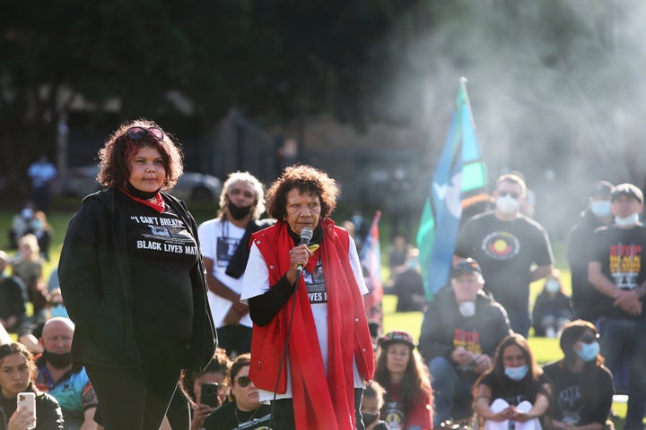 SYDNEY, AUSTRALIA - JULY 05: Leetona Dungay (R) speaks during a rally against Aboriginal and Torres Strait Islander deaths in custody in The Domain on July 05, 2020 in Sydney, Australia. Since the Royal Commission into Aboriginal deaths in custody ended in 1991 there have been over 400 deaths. Rallies have been organised across the country in solidarity with the global Black Lives Matter movement. (Photo by Lisa Maree Williams/Getty Images)