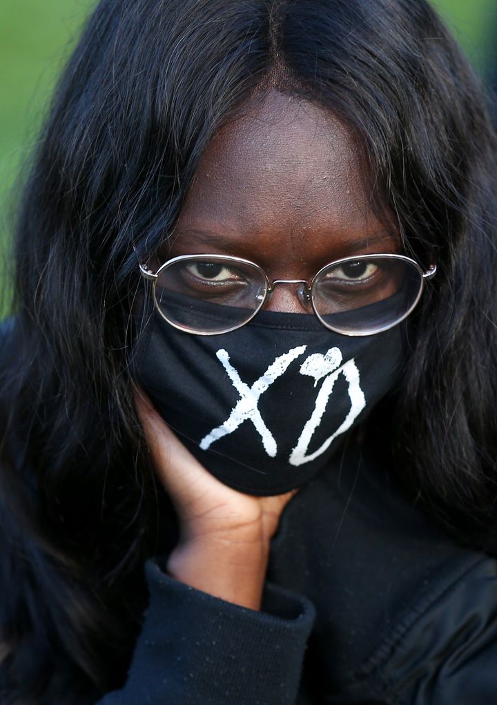 SYDNEY, AUSTRALIA - JULY 05: A woman looks on during a rally against Black Deaths in Custody in The Domain on July 05, 2020 in Sydney, Australia.The rally was organised to protest against Aboriginal and Torres Strait Islander deaths in custody and in solidarity with the global Black Lives Matter movement. (Photo by Don Arnold/Getty Images)