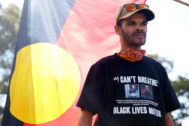 SYDNEY, AUSTRALIA - JULY 05: An Aboriginal man looks on during a rally against Black Deaths in Custody in The Domain on July 05, 2020 in Sydney, Australia.The rally was organised to protest against Aboriginal and Torres Strait Islander deaths in custody and in solidarity with the global Black Lives Matter movement. (Photo by Don Arnold/Getty Images)