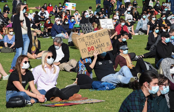 SYDNEY, AUSTRALIA - JULY 05: Protestors wearing face masks gather in the Domain on July 05, 2020 in Sydney, Australia. The rally was organised to protest against Aboriginal and Torres Strait Islander deaths in custody and in solidarity with the global Black Lives Matter movement. (Photo by James D. Morgan/Getty Images)