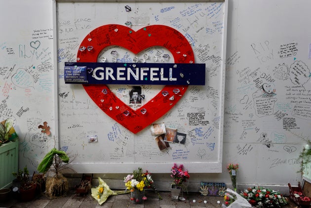 Tributes placed at the foot of Grenfell Tower, three years on from the disaster.