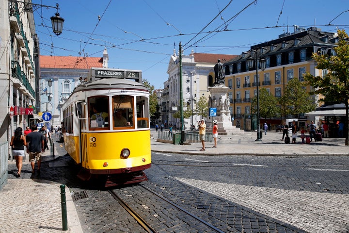 One of Lisbon's famous yellow trams, an attraction for the 4.5 million tourists who have been visiting the city each year.