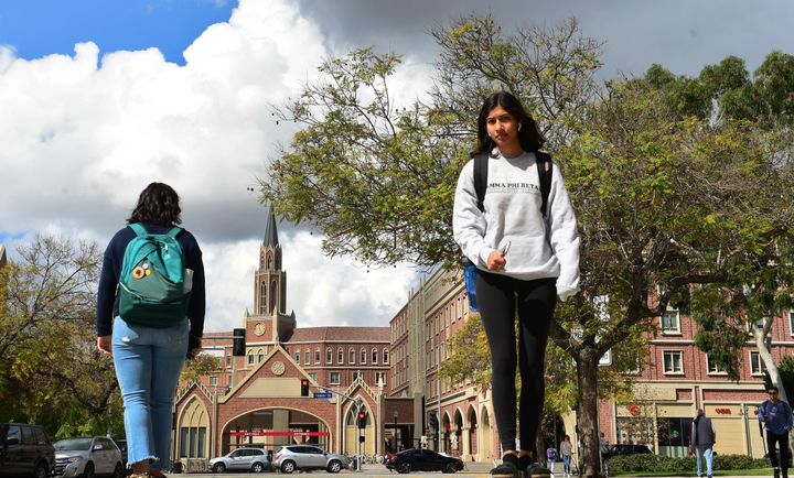 Students walk on campus at the University of Southern California (USC) in Los Angeles on March 11, 2020.