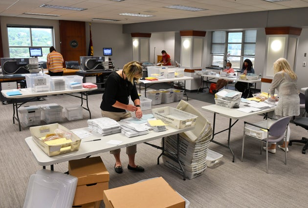 Election workers in Reading, Pennsylvania, open mail-in and absentee ballots on June