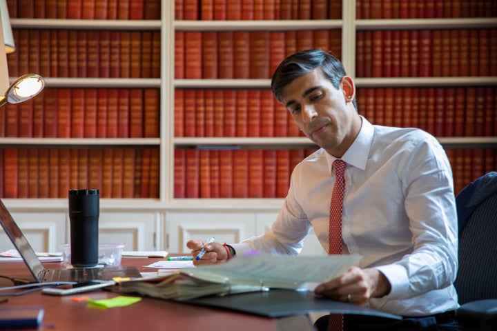 Undated handout photo issued by HM Treasury showing Chancellor of the Exchequer Rishi Sunak preparing the Economic Update he will present to Parliament tomorrow.