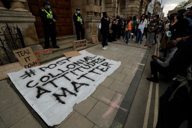 Supporters of the Rhodes Must Fall group take part in a protest calling for the removal of a statue of Cecil Rhodes at Oriel College, in Oxford.